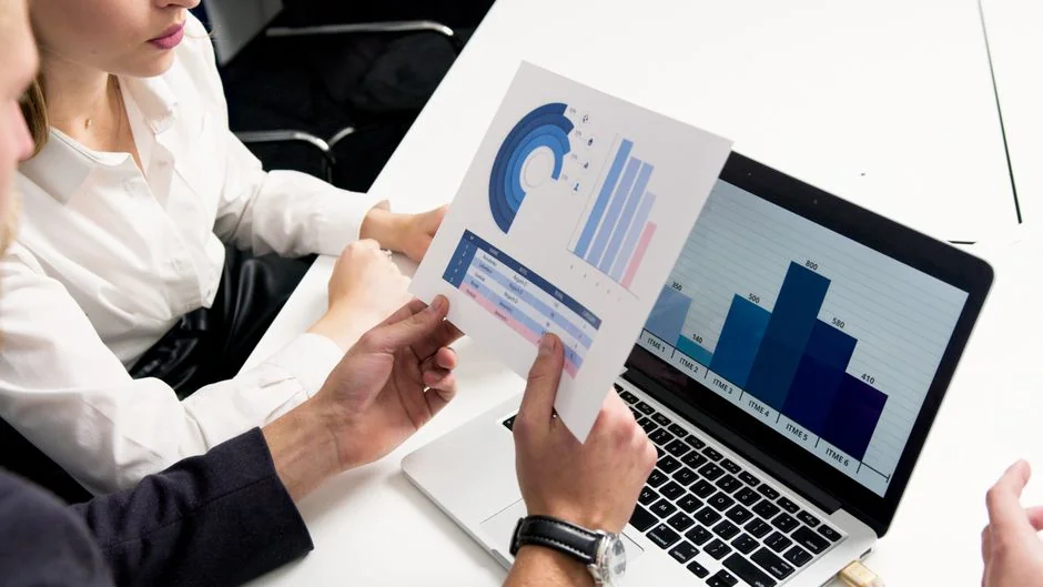 Close-up of various marketing documents on a desk, perfect for business and strategy discussions.
